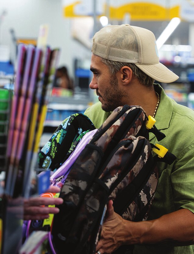 Carlos PenaVega shops for backpacks
